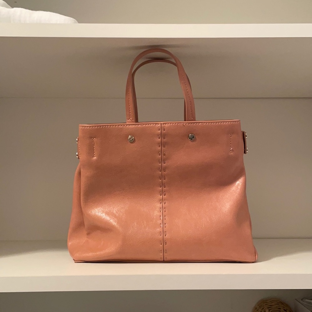 Pink Zara bag with strap.